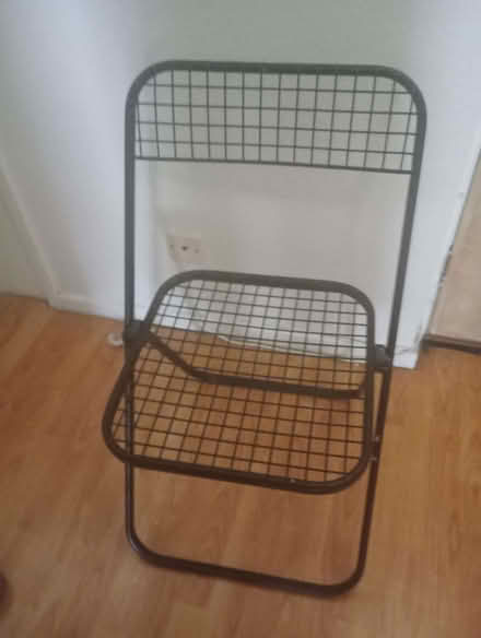 Photo of free Single black metal foldable dining chair. (West Croydon CR0)