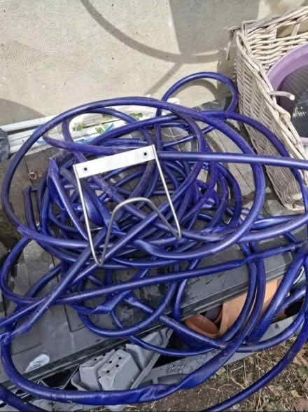 Photo of free Long hosepipe and wall bracket (DA11) #1