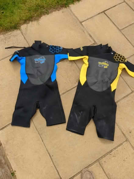 Photo of free 2 kid/teenage wetsuits 13 and 15yrs (WGC, knightsfield) #1