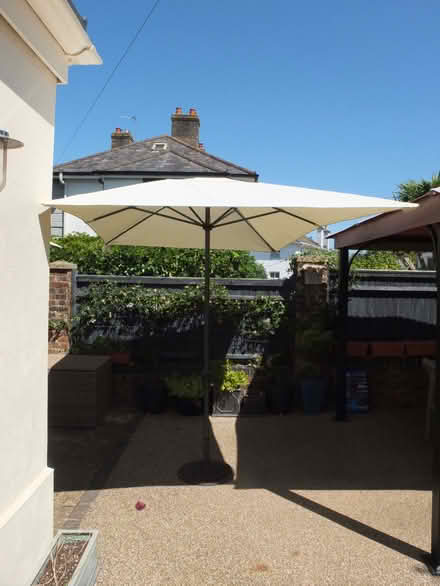 Photo of free Garden parasol and cast iron base (Battle TN33) #1