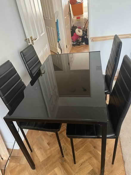 Photo of free Black table and four chairs (Beckton E16) #1
