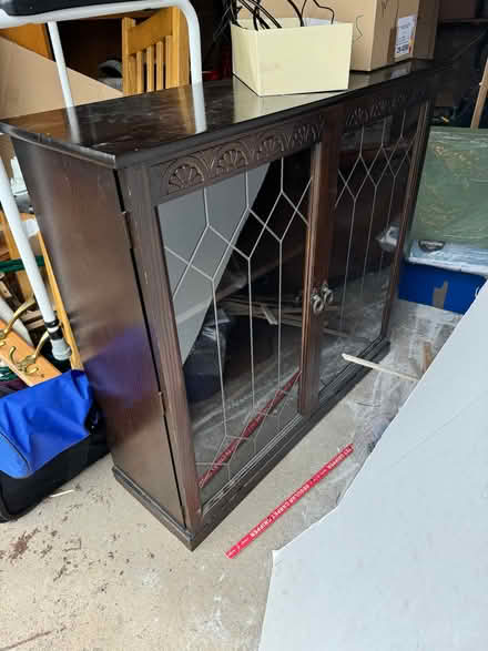 Photo of free Dark wood glass fronted cabinet (Studley B80) #1