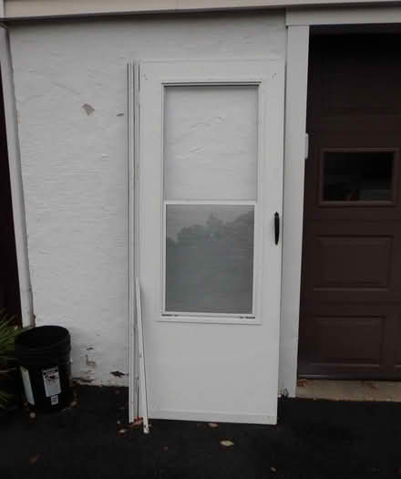 Photo of free Wood filled 32" x 80" storm door (South West side Lancaster, MA) #1
