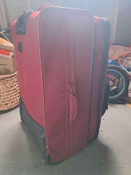 Photo of free Large red suitcase Vallaguzza (Chorleywood, WD3) #2