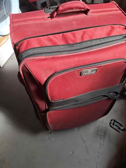Photo of free Large red suitcase Vallaguzza (Chorleywood, WD3) #1