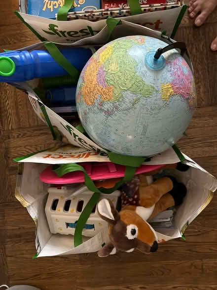 Photo of free Toys, games, piano books w/ 2 bins (UWS) #1