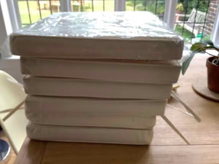 Photo of free 6 unused cream garden seat cushions (Walton on Thames) #1