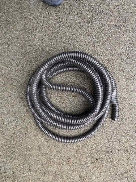Photo of free length of black pipe (? trunking pipe) unused, approx 4mtrs (Simonstone BB12) #1