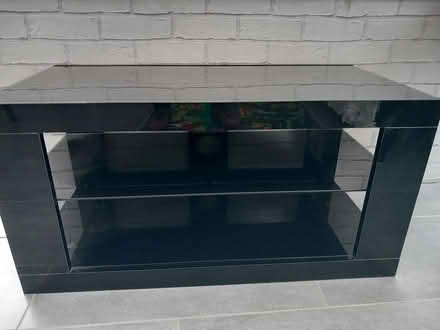 Photo of free Black glass TV unit (Writtle) #1