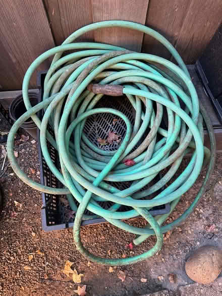 Photo of free Long garden hoses and rack (Terra Linda) #1