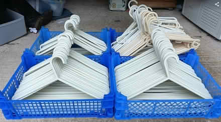 Photo of free 4 Trays of Plastic Clothes Hangers (Frimley, GU16) #1