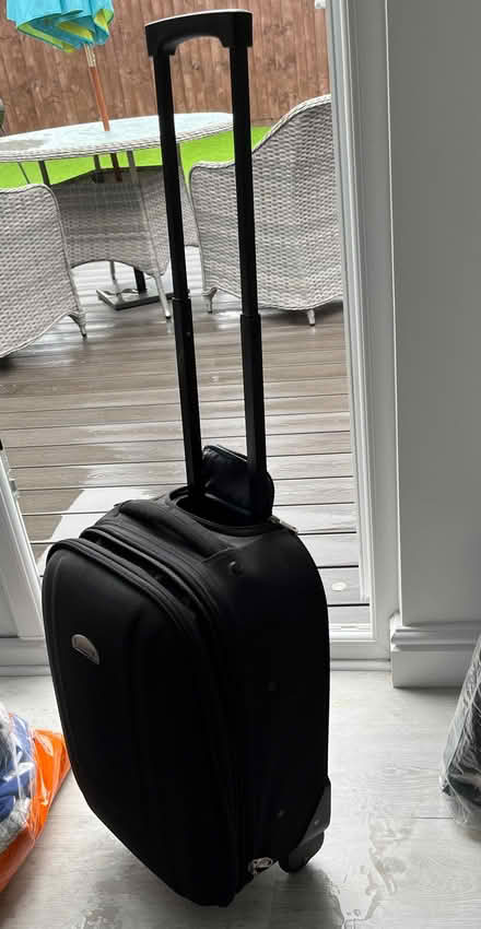 Photo of free Small black wheelie suitcase (Mandeville DT4) #1