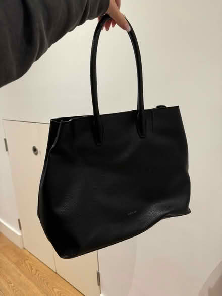 Photo of free Black leather handbag (Bow E3) #1