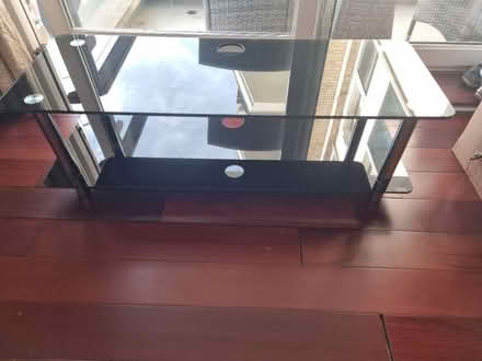 Photo of free Black glass TV unit stand (SW18) #1