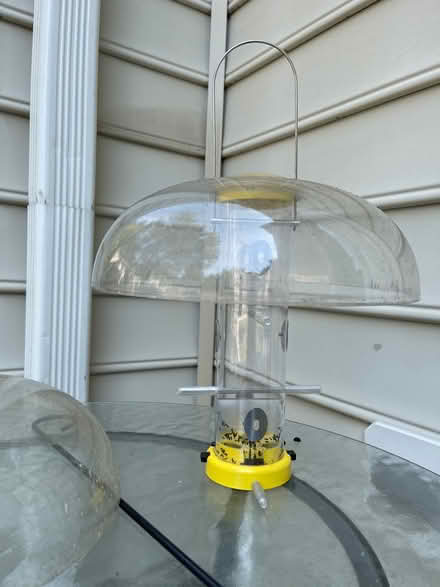 Photo of free Bird seed feeder, hook, rain guards (Piney Orchard) #1