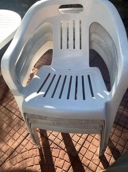 Photo of free 8 plastic garden chairs (Winyates West B98) #1