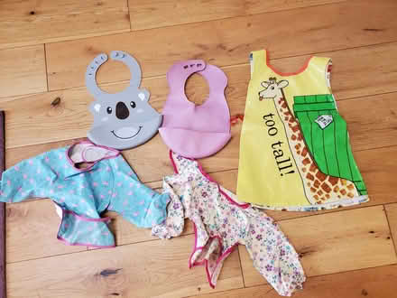 Photo of free 4 bibs for babies (0--12 months) and one Dear Zoo apron for (Colinton EH13) #1