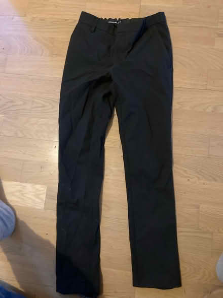 Photo of free 10-11 years black school trousers (M20 east didsbury) #1