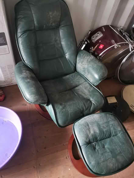 Photo of free Green leather chair and footstool (Lancing industrial estate) #1