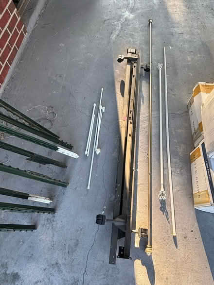 Photo of free Twin bed frame and curtain rods (Prien Lake area) #1