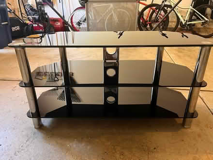 Photo of free Dark glass Tv stand (Fort Sheridan) #1