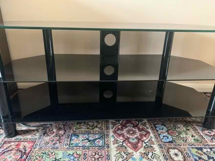 Photo of free Black glass TV stand (ME4) #1