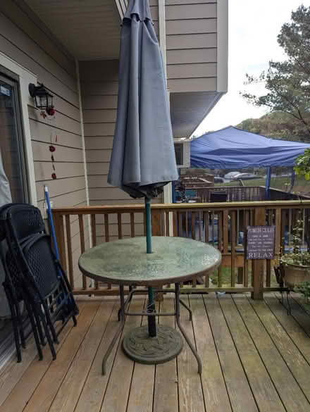 Photo of free Outdoor patio table and umbrella (Chelsea Cove North) #1