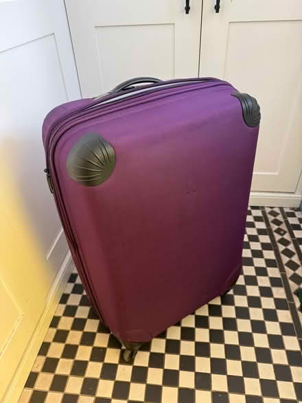 Photo of free Large purple suitcase (Burham Rochester) #2