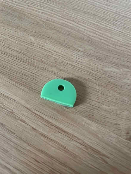 Photo of free 1 round key cap (green) (Huntingdon Rd & Storey's Way) #1