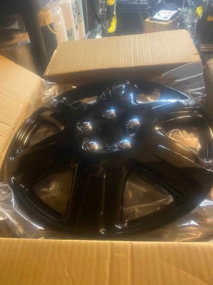 Photo of free 4 New Plastic Wheel Covers 16” Tire (Near 75th and Woodridge Dr.) #1