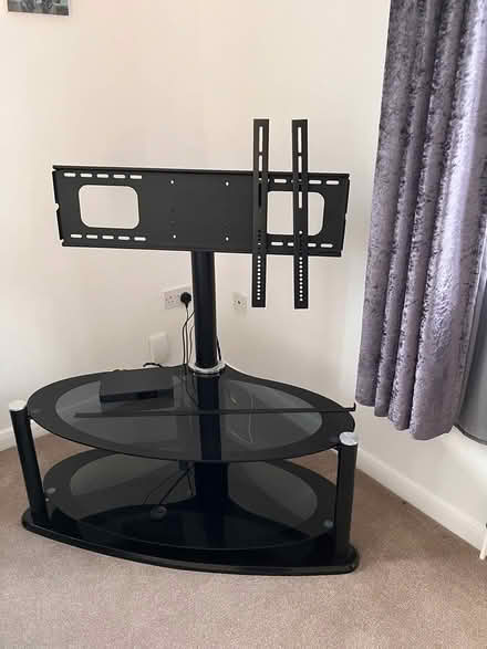 Photo of free Black metal and glass oval TV stand (Drighlington (nr morley) BD11) #1
