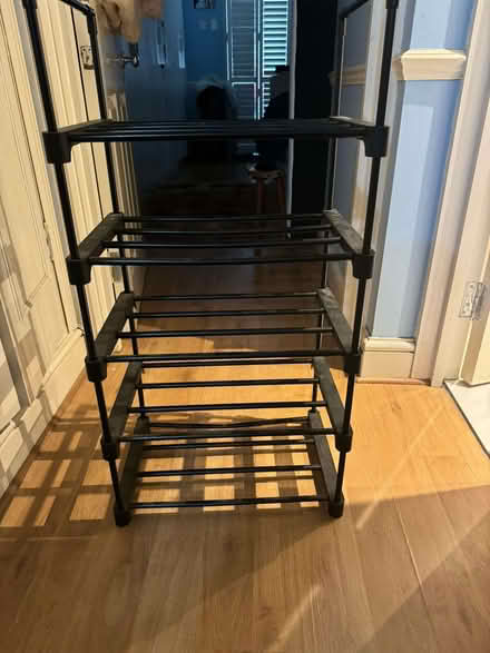 Photo of free 3/4 Tier black shoe rack (Shepherds Bush W6) #1