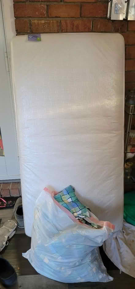 Photo of free Baby mattress with linens (Randallstown) #1
