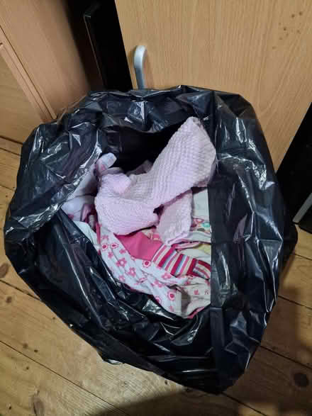 Photo of free Black bag of used baby girl clothes (Luton LU2) #1