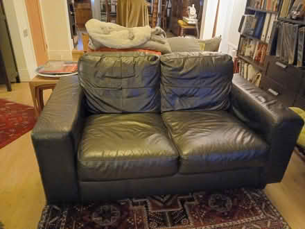Photo of free IKEA Sofa black leather 2 seater (New York NE29) #1