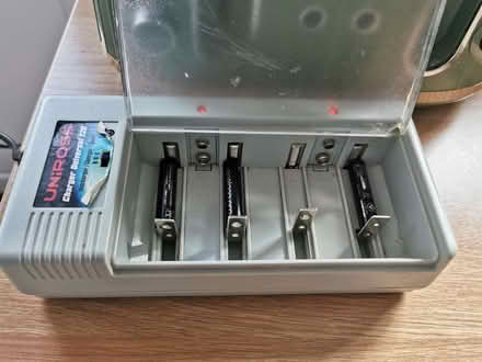 Photo of free Uniross battery charger. (Wood Top) #1