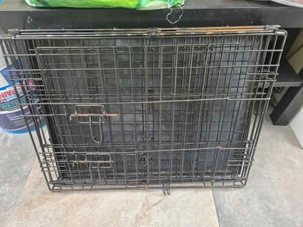 Photo of free 24in small black dog crate (Cheltenham) #1