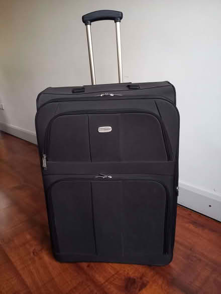 Photo of free Large suitcase (Old Woking GU22) #1