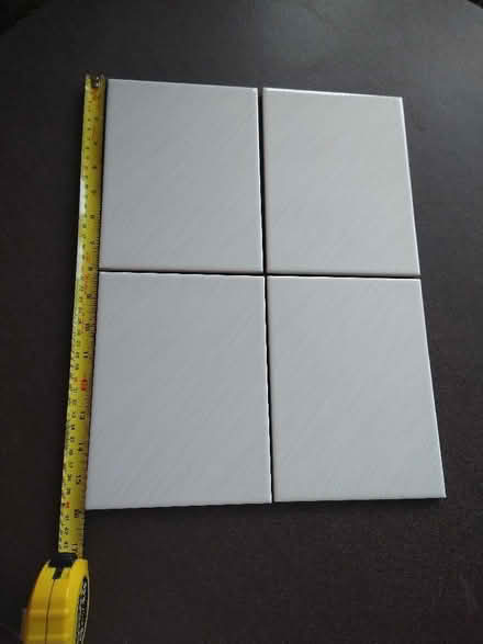 Photo of free 4 cream/grey tiles with fine diagonal stripes. (Garston WD25) #1