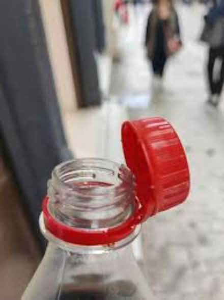 Photo of Plastic bottle caps near stamp end (Lincoln LN2) #1