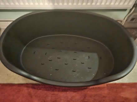Photo of free Black plastic dog bed (Pudsey LS28) #1