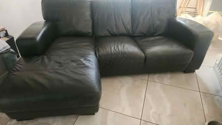 Photo of free Black Leather sofa good condition (Killester) #1