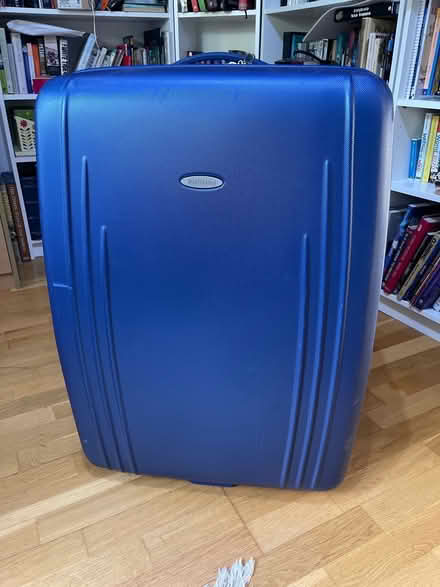 Photo of free Large blue hard suitcase (OX3) #1