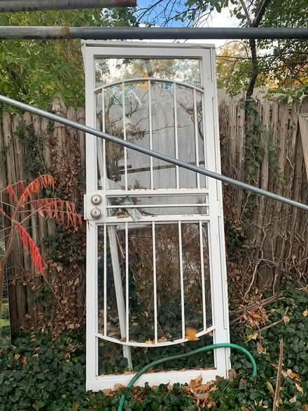 Photo of free Metal & Glass Storm Door (Colo Blvd/ Hampden) #1