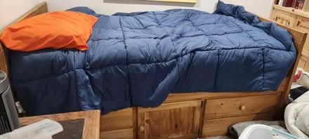 Photo of free Wood bed with Storage (Near 55th & Cass) #1