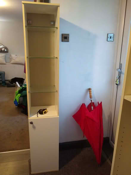 Photo of free Tall thin case with glass shelves. (Kenilworth CV8) #1