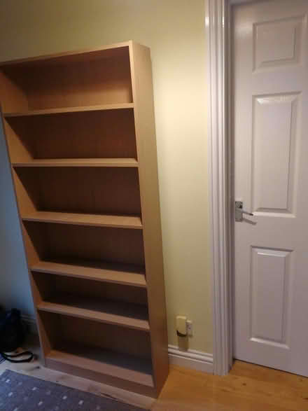 Photo of free Tall wood shelves (CO2 Colchester, Mersea Road) #1