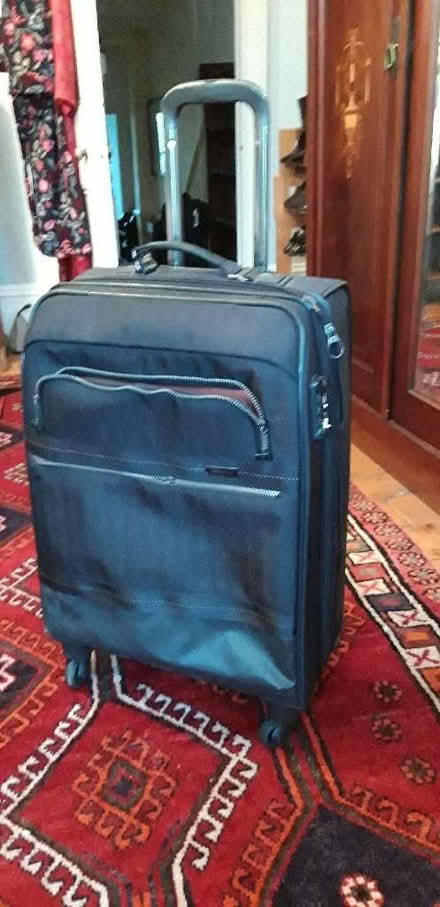 Photo of free Large black suitcase, 4 wheels (Highbury Barn N5) #1