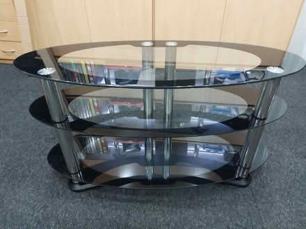 Photo of free Black clear glass tv unit (Lostock Junction BL6) #1