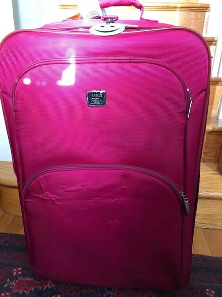 Photo of free Pink rolling suitcase (Chevy Chase DC) #1